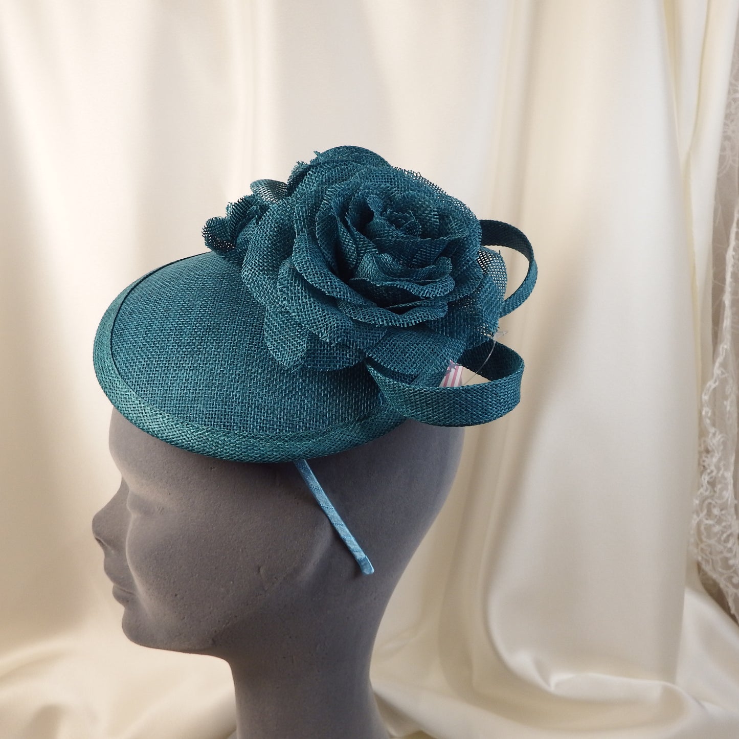 Teal hat with flower detail