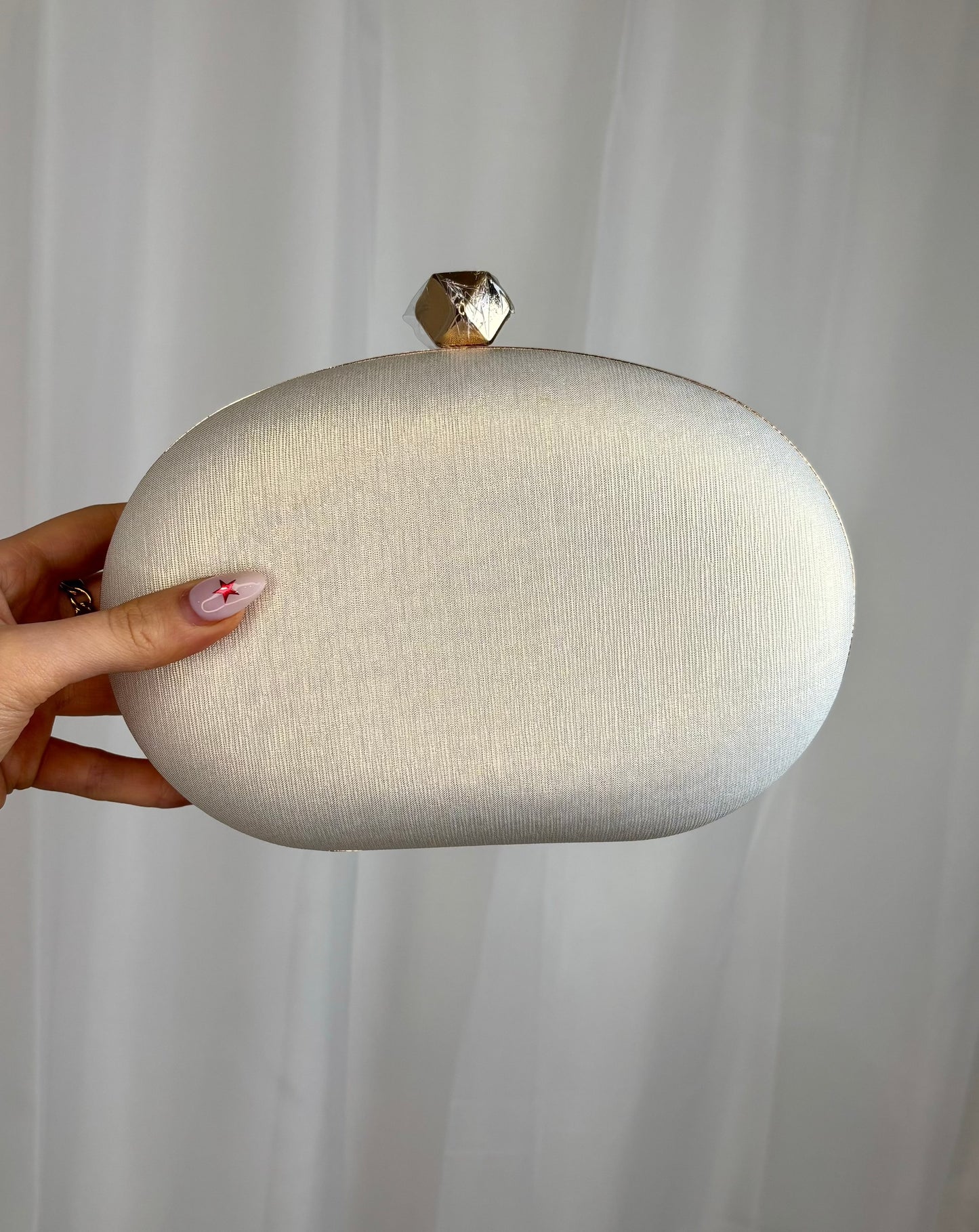 Gold Oval Clutch With Gold Trim