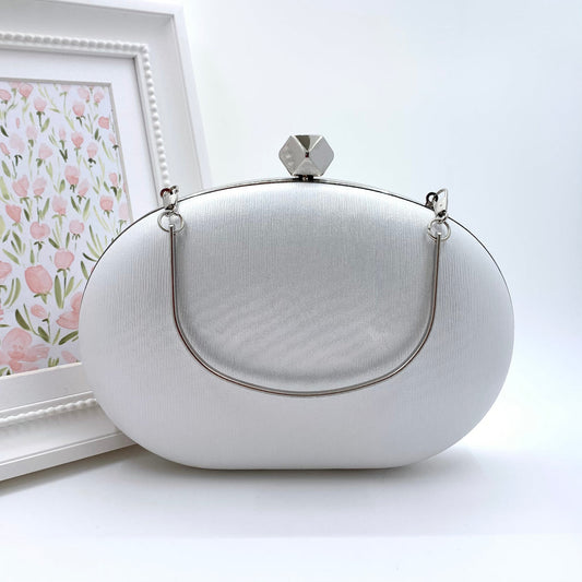 White Oval Clutch With Silver Frame